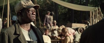 Movie still from “The Highwaymen” (2019), directed by John Lee Hancock – A group of people sitting around a table; Close Up shot, Over the shoulder angle
