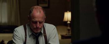 Movie still from “The Highwaymen” (2019), directed by John Lee Hancock – An older man sitting in front of a lamp; Close Up shot, Over the shoulder angle
