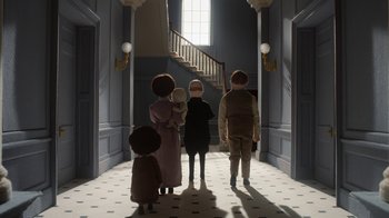 Movie still from “The House” (2022), directed by Paloma Baeza – A group of people standing in a hallway; Wide shot, Low angle