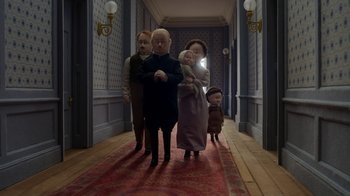 Movie still from “The House” (2022), directed by Paloma Baeza – A group of people standing in a hallway with dolls; Wide shot, Low angle