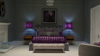 Movie still from “The House” (2022), directed by Paloma Baeza – A bedroom with a bed and two nightstands with lamps on either side of the bed; Wide shot, High angle