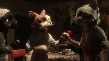 Movie still from “The House” (2022), directed by Paloma Baeza – Two stuffed animals are holding hands in a room; Medium shot, Over the shoulder angle