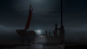 Movie still from “The House” (2022), directed by Paloma Baeza – A sailboat sitting on a dock in the dark; Extreme Wide shot, High angle