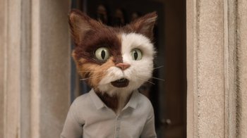 Movie still from “The House” (2022), directed by Paloma Baeza – A person wearing a cat mask and a white shirt; Close Up shot, High angle