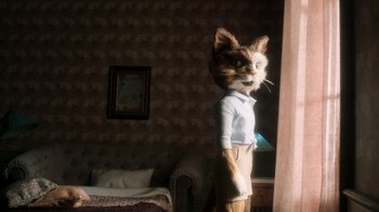 Movie still from “The House” (2022), directed by Paloma Baeza – A cat wearing a dress shirt and shorts; Medium shot, Low angle