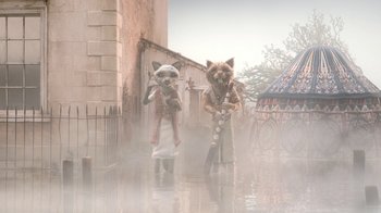 Movie still from “The House” (2022), directed by Paloma Baeza – A couple of cats are standing next to each other in the water; Wide shot, Low angle