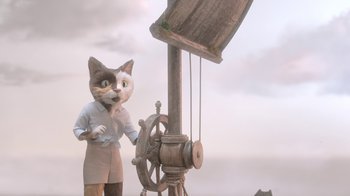 Movie still from “The House” (2022), directed by Paloma Baeza – A cat is standing next to a steering wheel; Wide shot, High angle