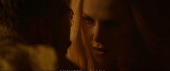 Movie still from “The Huntsman: Winter's War” (2016), directed by Cedric Nicolas-Troyan – A woman's face in a dimly - lit room; Close Up shot, Over the shoulder angle