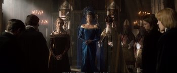 Movie still from “The Huntsman: Winter's War” (2016), directed by Cedric Nicolas-Troyan – A group of people standing next to each other in a room; Wide shot, Low angle