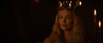 Movie still from “The Huntsman: Winter's War” (2016), directed by Cedric Nicolas-Troyan – A woman wearing a gold crown in a dark room; Close Up shot, Low angle