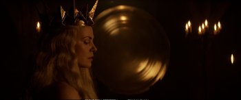 Movie still from “The Huntsman: Winter's War” (2016), directed by Cedric Nicolas-Troyan – A woman wearing a paper crown and a gold necklace; Close Up shot, Over the shoulder angle