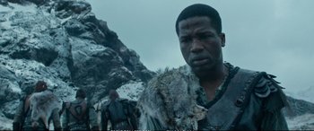 Movie still from “The Huntsman: Winter's War” (2016), directed by Cedric Nicolas-Troyan – A man with a fur coat standing in front of a mountain; Close Up shot, Low angle
