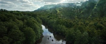 Movie still from “The Huntsman: Winter's War” (2016), directed by Cedric Nicolas-Troyan – A view of a body of water surrounded by trees and mountains; Extreme Wide shot, High angle