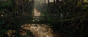 Movie still from “The Huntsman: Winter's War” (2016), directed by Cedric Nicolas-Troyan – Two people standing on a bridge over a river; Extreme Wide shot, High angle