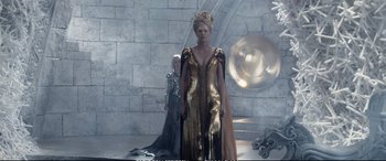 Movie still from “The Huntsman: Winter's War” (2016), directed by Cedric Nicolas-Troyan – A woman in a gold dress standing next to another woman in a black dress; Wide shot, Low angle