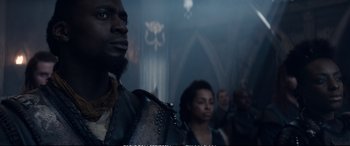 Movie still from “The Huntsman: Winter's War” (2016), directed by Cedric Nicolas-Troyan – A group of people standing in front of a building; Close Up shot, Over the shoulder angle