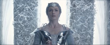Movie still from “The Huntsman: Winter's War” (2016), directed by Cedric Nicolas-Troyan – A person wearing a costume; Medium shot, Low angle