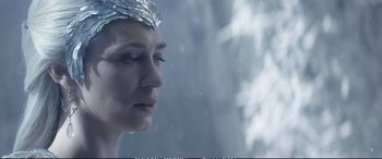 Movie still from “The Huntsman: Winter's War” (2016), directed by Cedric Nicolas-Troyan – A person wearing a silver headpiece; Close Up shot, Over the shoulder angle