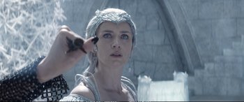Movie still from “The Huntsman: Winter's War” (2016), directed by Cedric Nicolas-Troyan – A person putting makeup on her face; Close Up shot, Over the shoulder angle