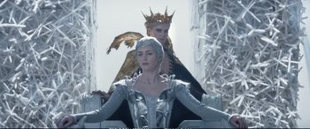 Movie still from “The Huntsman: Winter's War” (2016), directed by Cedric Nicolas-Troyan – Two women dressed as ice queens in a snowy setting; Medium shot, Low angle