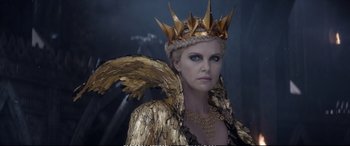 Movie still from “The Huntsman: Winter's War” (2016), directed by Cedric Nicolas-Troyan – Charlize theron as the evil queen in the movie snow white and the seven dwarfs; Close Up shot, Over the shoulder angle