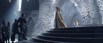 Movie still from “The Huntsman: Winter's War” (2016), directed by Cedric Nicolas-Troyan – A man dressed as a king standing on a staircase; Wide shot, High angle