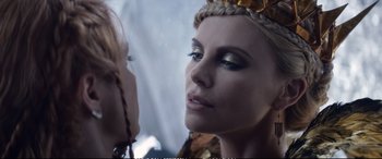 Movie still from “The Huntsman: Winter's War” (2016), directed by Cedric Nicolas-Troyan – A woman's face with makeup on; Close Up shot, Over the shoulder angle