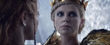 Movie still from “The Huntsman: Winter's War” (2016), directed by Cedric Nicolas-Troyan – A person looking at a mirror; Close Up shot, Over the shoulder angle