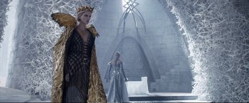 Movie still from “The Huntsman: Winter's War” (2016), directed by Cedric Nicolas-Troyan – Two women dressed in costumes in a castle setting; Wide shot, Low angle