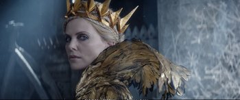 Movie still from “The Huntsman: Winter's War” (2016), directed by Cedric Nicolas-Troyan – A person wearing a costume; Close Up shot, Over the shoulder angle