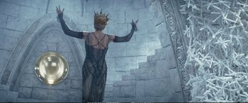 Movie still from “The Huntsman: Winter's War” (2016), directed by Cedric Nicolas-Troyan – A woman in a black dress with a crown on her head; Medium shot, Overhead angle