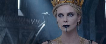 Movie still from “The Huntsman: Winter's War” (2016), directed by Cedric Nicolas-Troyan – Charlize theron as the evil queen in the movie snow white and the seven dwarfs; Close Up shot, High angle