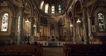 Movie still from “The Irishman” (2019), directed by Martin Scorsese – A large church with a lot of chairs in it; Extreme Wide shot, High angle