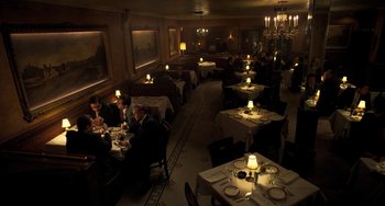 Movie still from “The Irishman” (2019), directed by Martin Scorsese – People are sitting at tables in a large restaurant; Extreme Wide shot, High angle