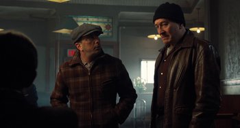 Movie still from “The Irishman” (2019), directed by Martin Scorsese – Two men standing next to each other in a room; Medium shot, Over the shoulder angle