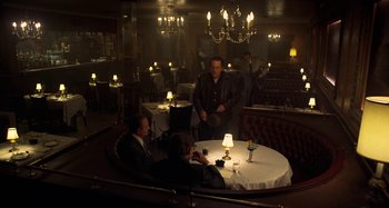 Movie still from “The Irishman” (2019), directed by Martin Scorsese – A group of people sitting around a table in a restaurant; Wide shot, High angle