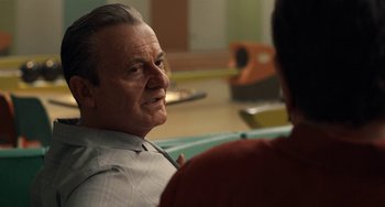 Movie still from “The Irishman” (2019), directed by Martin Scorsese – An older man sitting in front of a younger man; Close Up shot, Over the shoulder angle