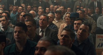 Movie still from “The Irishman” (2019), directed by Martin Scorsese – A group of people sitting in a room; Medium shot, High angle