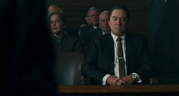 Movie still from “The Irishman” (2019), directed by Martin Scorsese – A group of people sitting in a courtroom; Medium shot, Low angle