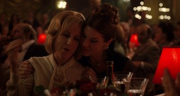 Movie still from “The Irishman” (2019), directed by Martin Scorsese – Two women sitting at a table with a wine glass; Close Up shot, Over the shoulder angle