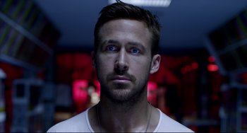 Movie still from “Only God Forgives” (2013), directed by Nicolas Winding Refn – A person wearing a white t - shirt; Close Up shot, Over the shoulder angle