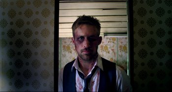 Movie still from “Only God Forgives” (2013), directed by Nicolas Winding Refn – A person wearing a shirt and tie; Close Up shot, Over the shoulder angle