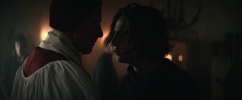 Movie still from “The King” (2019), directed by David Michôd – A man and a woman face to face in the dark; Close Up shot, Over the shoulder angle