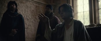 Movie still from “The King” (2019), directed by David Michôd – Two men in medieval garb standing next to each other; Medium shot, Over the shoulder angle