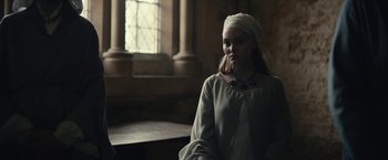 Movie still from “The King” (2019), directed by David Michôd – A woman wearing a white dress and a white turban; Medium shot, Over the shoulder angle