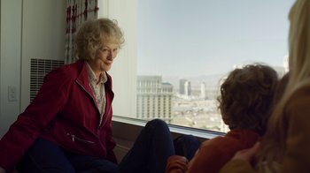 Movie still from “The Laundromat” (2019), directed by Steven Soderbergh – Two women sitting in front of a large window; Close Up shot, Over the shoulder angle