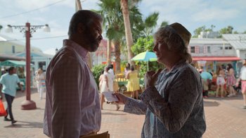 Movie still from “The Laundromat” (2019), directed by Steven Soderbergh – A man and a woman talking to each other outside; Medium shot, Over the shoulder angle