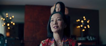 Movie still from “The Laundromat” (2019), directed by Steven Soderbergh – A woman in a red shirt and a woman in a black and red dress; Close Up shot, Over the shoulder angle