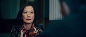Movie still from “The Laundromat” (2019), directed by Steven Soderbergh – An older woman sitting in front of a mirror; Close Up shot, Over the shoulder angle