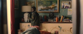 Movie still from “The Life Ahead” (2020), directed by Edoardo Ponti – A young man standing next to a bed in a room; Medium shot, Over the shoulder angle